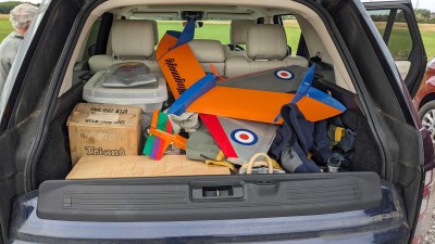 A Weekender (built by Wayne in Australia) sits unflown (under other other models in the car) due to the wind