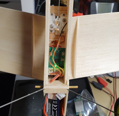 The Rx in its place....mini/micro servos are in the pipeline but not ready yet. For comparison the antenna whisker is 30 mm (1 &amp; 1/4&quot;)