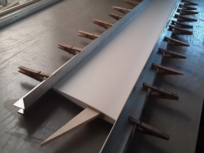 Run some Superphatic down the LE, spar and trailing edge, smooth out, add top skin, clamp with pegs with another aluminium bar.