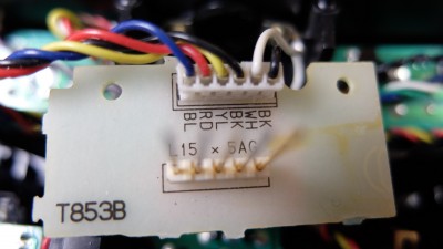 The T853B board with the blurry pins is where the module plugs into. I was planning on removing the header with the long pins and soldering the 3 XHT wires to the board. Removing the insides of the plug in module box, modifying it to fit the bind board in it