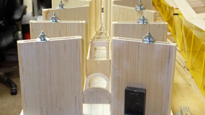 The fuselage taking shape in the jig. <br />Somewhat dwarfed in the huge jig originally <br />created to build a Leprechaun fuselage. <br />It does however prevent building a banana shaped fuselage.