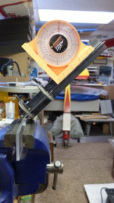 My brother has access to a metal shear so he cut a couple of blanks for me. Here it is being bent to shape. At this point ALL holes have been drilled for mounts and axles prior to bending.