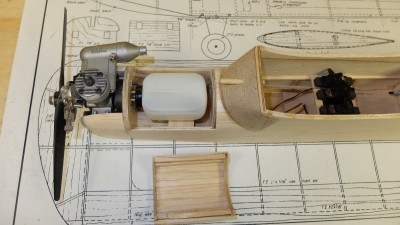 Fuel tank located and servo rails temporarily in place. I will slide them back &amp; forth along the 1/8&quot; square beams to get the best balance when the covering is completed. I will also add some vertical 1/8&quot; square braces from the servo beams to the wing saddles to stiffen up the cabin area after the servos are in their final location.